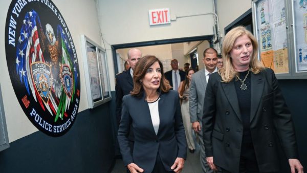 Gov. Kathy Hochul walking with staff