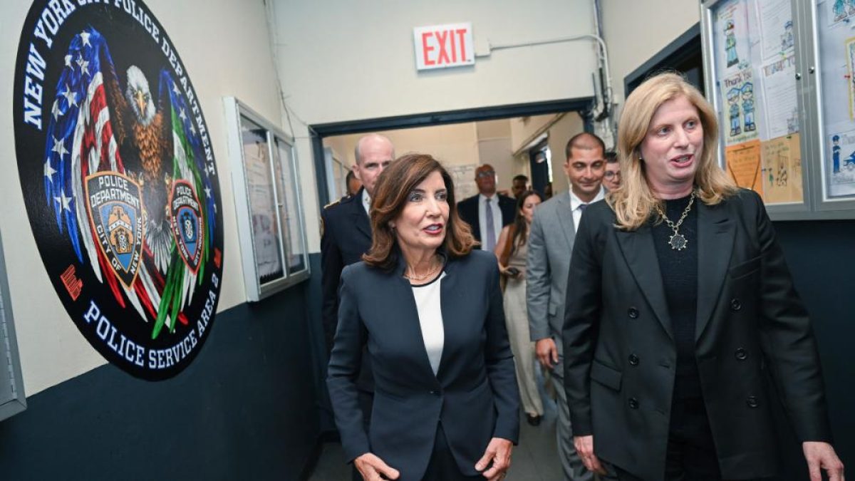 Gov. Kathy Hochul walking with staff